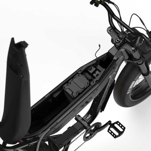 Side view of the eMOTO eBike Super73 B1G SE in a showroom, showcasing its black frame, thick tires, and minimalist design, available for in-store pickup only.