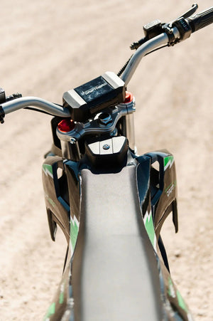 A black eMOTO eBike Drift Hero 2500w dirt bike with rugged tires, sturdy frame, and sporty design, displayed on a white background.