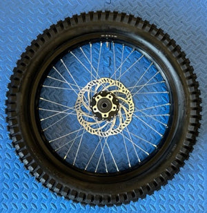 Product image of the eMOTO Surron eMoto Wheel Set featuring Shinko 241 Dual Sport tires in 19-inch and 21-inch sizes, showing both front and rear wheels for moto bikes; rotors and sprockets are not included.
