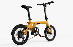 Urtopia Carbon Fold 1 eBike in Saffron Yellow, side view, folded position, showcasing compact design and lightweight carbon frame.