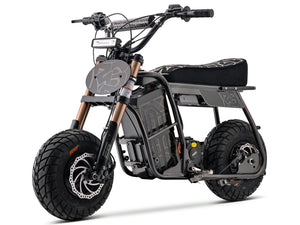 Side view of the eMOTO Stomp Ebox Dragster RS electric dirt bike in black and green, displayed on a white background.
