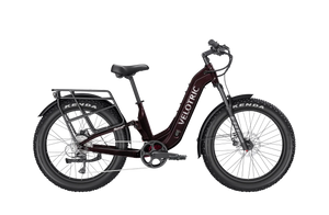 A Velotric Nomad 2X eBike in step-thru frame design, shown from the side with visible battery, wide tires, and upright handlebars.