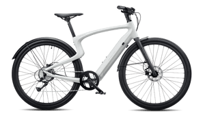 Urtopia Carbon1 Pro eBike in creme color, shown inside its original box with packaging materials.