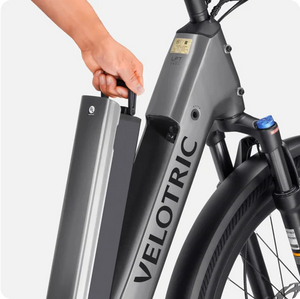 Side view of the Velotric Discover 2 eBike in white, showcasing its step-through frame, rear rack, and integrated battery.