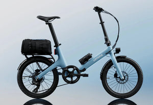 A black Urtopia Carbon Fold Step Thru eBike with a lightweight carbon fiber frame, step-through design, and compact folding mechanism, displayed on a white background.