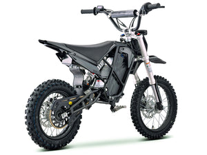 Side view of the eMOTO Stomp Ebox V3 72 RS electric dirt bike, showcasing its black and green frame, knobby tires, and modern design against a plain background.