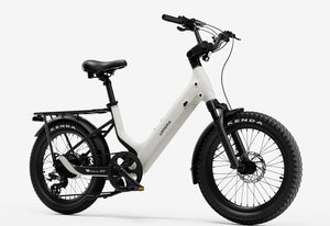 Side view of the Urtopia Carbon Joy eBike in creme color, showcasing its lightweight carbon frame, sleek design, and integrated battery against a plain background.