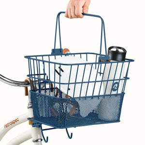 Navy blue Retrospec Apollo steel eBike basket attached to a bicycle, side view