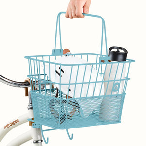 Retrospec Apollo steel bike basket in cool mint color attached to an eBike