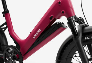 Side view of the Urtopia Carbon Joy eBike in Rose Red, showcasing its lightweight carbon frame, sleek design, and integrated battery against a plain background.