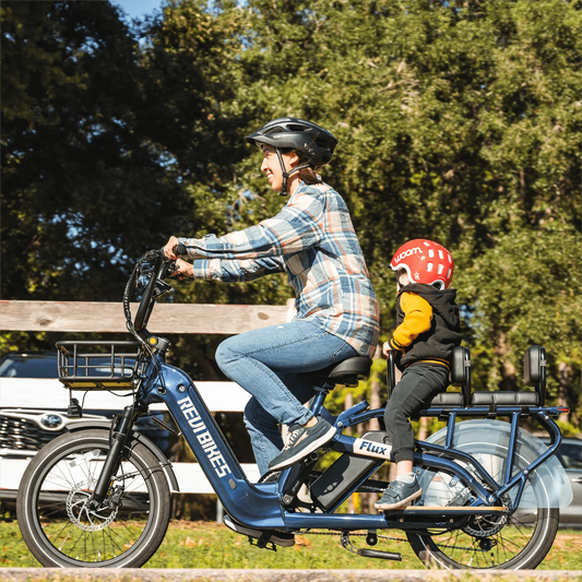 A REVI Flux 750w Step Thru electric bike with 20x2.4 inch fat tires, shown as a compact cargo eBike in a product image.
