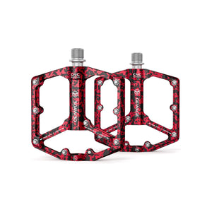 Red camouflage alloy eBike pedals with a textured surface and durable construction, shown in a product image.