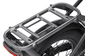 A side view of the Velotric Fold 1 Plus eBike in a folded position, showcasing its compact design, sturdy frame, and integrated battery.