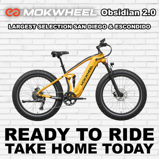 Yellow and black Mokwheel Obsidian 2.0 electric bike, side view, against a white background.