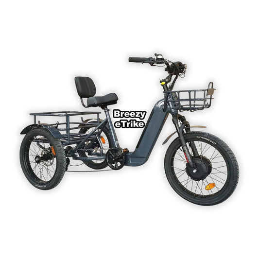 Blue eBike Breezy Electric Trike in its box, product image on a grey background