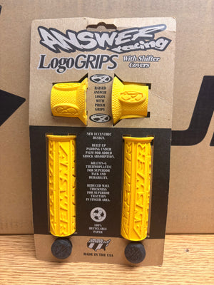 Yellow Answer Racing eBike grips, textured surface, displayed on a white background.