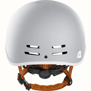 Matte bone Retrospec Remi eBike helmet, side view, showing adjustable straps and ventilation holes