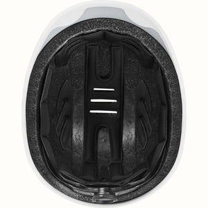 Matte bone Retrospec Remi eBike helmet, side view, with adjustable straps and ventilation holes