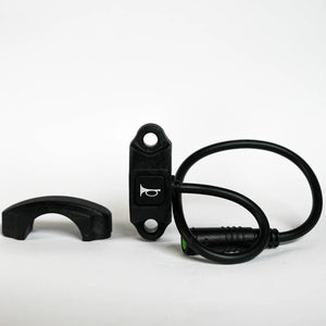 Close-up of a black eBike horn switch designed for Super73, featuring a compact rectangular button with wiring attached.