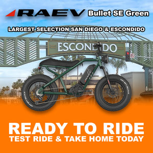 Metallic green Raev Bullet eBike parked outdoors, side view, with R2R Escondido branding visible.