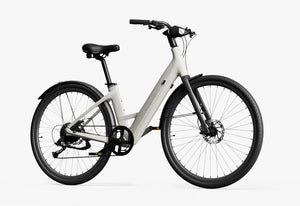 Side view of the Urtopia Carbon 1 Step Thru eBike in creme color, showcasing its lightweight carbon frame, step-through design, and sleek modern styling against a plain background.