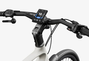 Side view of the Urtopia Carbon Classic eBike in creme color, showcasing its lightweight carbon frame, sleek design, and integrated components against a plain background.