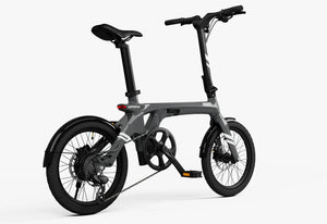 Side view of the Urtopia Carbon Fold 1 eBike in charcoal gray, showcasing its lightweight carbon frame, compact folding design, and sleek modern appearance.