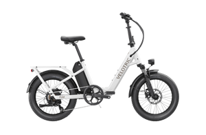 Pearl White Velotric Fold 1 eBike, folded, side view, against a plain background