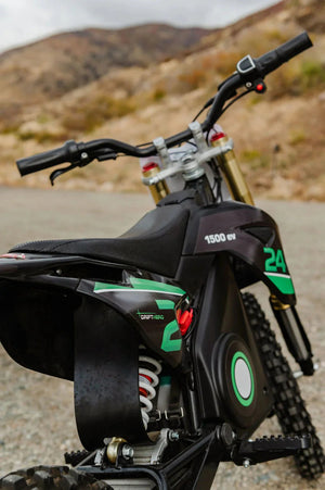 A black eMOTO eBike Drift Hero 1600w dirt bike shown from a side angle, featuring rugged tires, a sturdy frame, and a sporty design suitable for off-road riding.