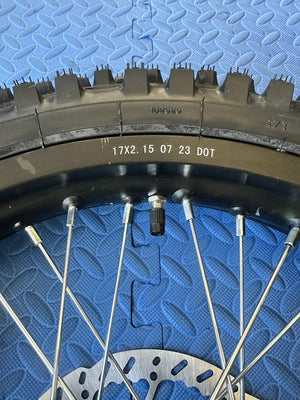 Product image of the eMOTO Surron eMoto Wheel Set featuring a CST knobby 17-inch rear wheel and tire set for electric dirt bikes, shown without rotor or sprocket.