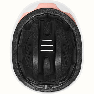 Rose gold Retrospec Remi eBike helmet, side view, with adjustable straps and ventilation holes