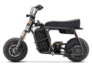 eMOTO Stomp Ebox Dragster RS electric dirt bike, side view, black and green color scheme, displayed on a white background