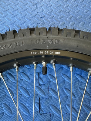 Surron eMoto 19-inch front wheel and Shinko 244 dual sport tire set for e-moto bikes, shown without rotor or sprocket.
