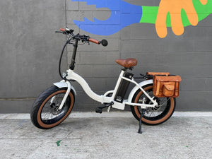 White custom folding electric bike with step-thru frame, 20-inch fat tires, foldable design, product image against a white background.