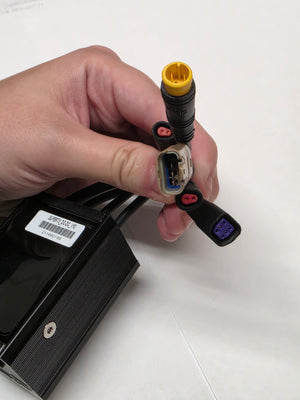 Close-up view of the Super73 DCDC Converter (Version 1) for eBikes, showing the compact black rectangular unit with attached wiring and connectors on a white background.