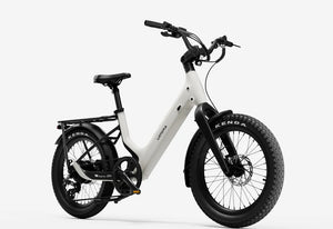 Side view of the Urtopia Carbon Joy Ultra eBike in creme color, showcasing its lightweight carbon frame, sleek design, and integrated battery against a plain background.