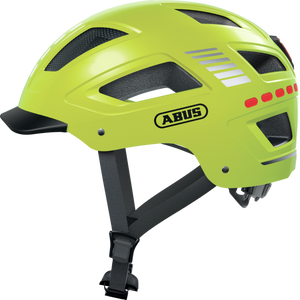 Yellow Abus Hyban 2.0 LED eBike helmet, size large, displayed in-store with visible LED light and ventilation openings.