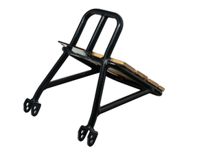 Side view of the Stomp Ebox Dragster Carry Rack mounted on an electric bike, showcasing its sturdy metal construction and attachment points.