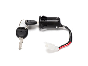 Close-up view of the Stomp Ebox ignition barrel and key, showing the metal ignition barrel with attached wiring and a single black plastic key.