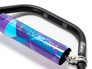 Stomp Ebox Megalith handlebar in purple and blue, close-up side view showing grip texture and color gradient.