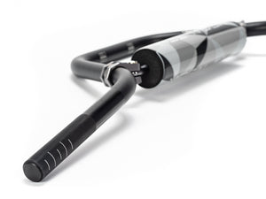 Stomp Ebox Megalith Pitspeed 7075 handlebar, close-up view showing black anodized finish and ergonomic design, photographed against a white background.