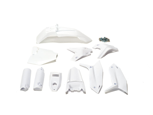 White plastic kit components for Stomp Ebox, including fenders, side panels, and number plate, displayed on a plain background.