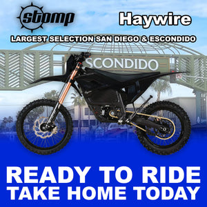 Stomp Haywire eMOTO Black R2R electric dirt bike, side view, black frame, rugged tires, modern design