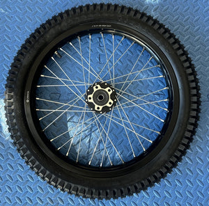 Alt text: Surron eMoto wheel set with Shinko 241 dual sport tires, 18-inch rear and 21-inch front wheels for moto bikes, shown without rotor or sprocket.