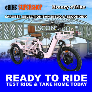 Pink eBike Breezy electric trike, ready to ride, side view against a plain background
