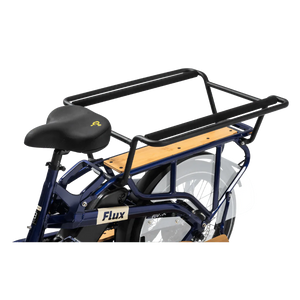 A sleek eBike Revi Flux ST in a studio setting, showcasing its modern frame design, integrated battery, and upright handlebars.