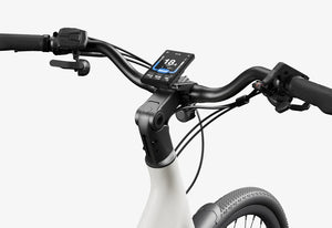 Side view of the Urtopia Carbon Classic Step Thru eBike in creme color, showcasing its lightweight carbon frame, step-through design, and sleek modern styling against a plain background.