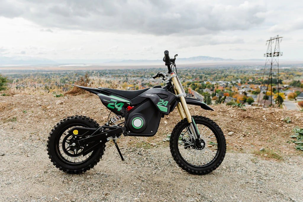Side view of the eMOTO eBike Drift Hero 1600w dirt bike in black and green, showcasing its rugged tires, sturdy frame, and off-road design.