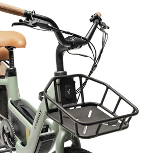Electric bike Segway Muxi, side view, black frame, modern design, parked on pavement with greenery in background.