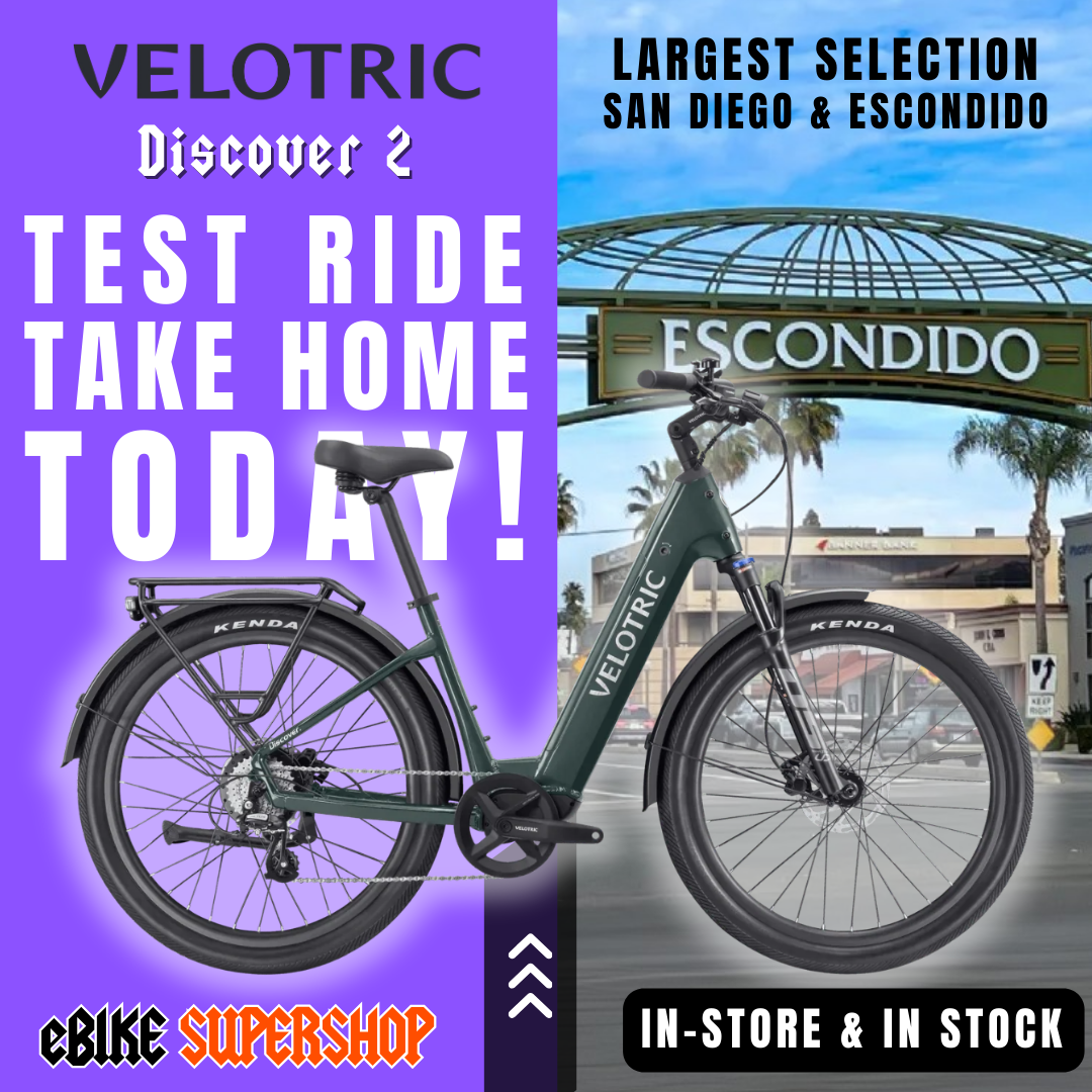Velotric Discover 2 eBike in Pine Green, shown in its box with product packaging, model R2R Green